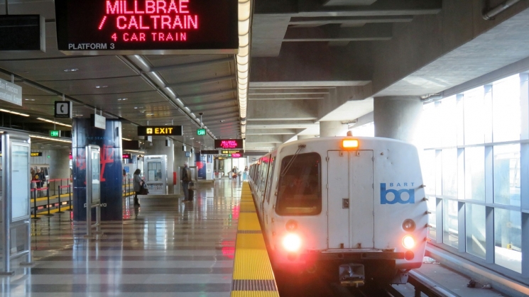 Park at Millbrae Station and take BART to SFO BARTable